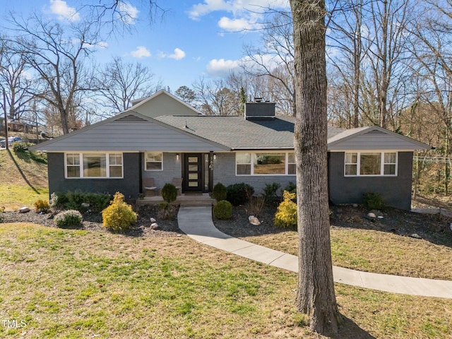 1603 N Alston Ave, Durham, NC 27701 - view of front facade with a chimney and a front yard