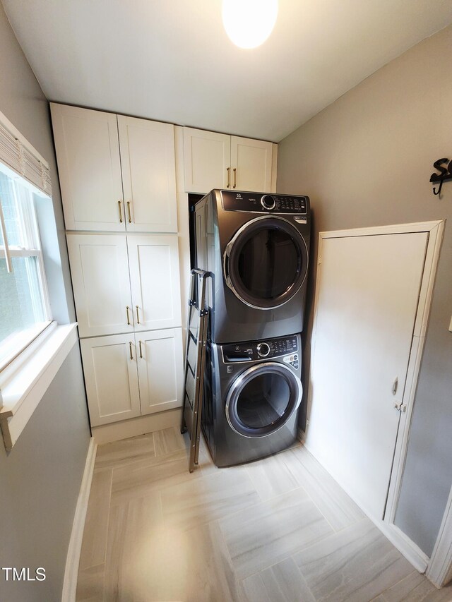 1603 N Alston Ave, Durham, NC 27701 - laundry area featuring cabinet space and stacked washer / drying machine