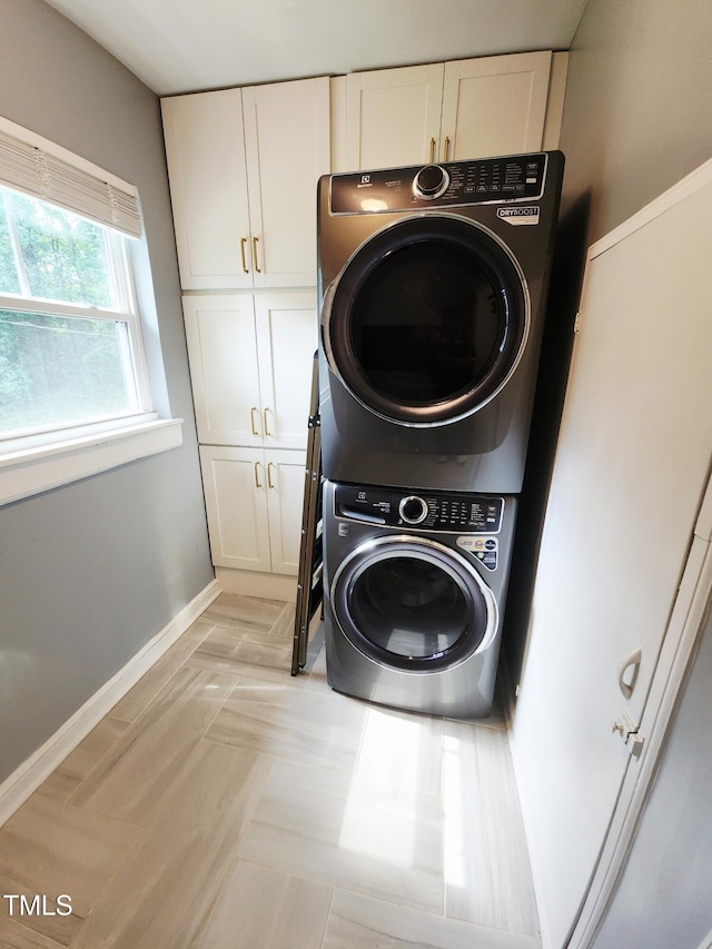 1603 N Alston Ave, Durham, NC 27701 - laundry area featuring cabinet space and stacked washer and clothes dryer