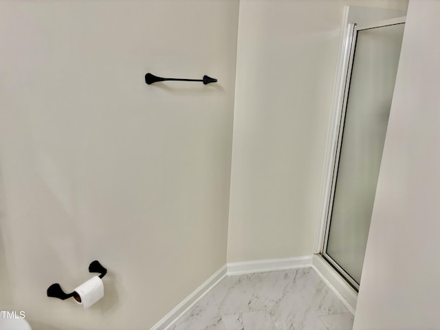 1121 Brookhill Way, Cary, NC 27519 - bathroom featuring a stall shower and marble look tile flooring