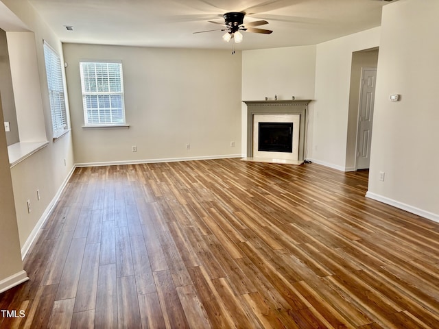 1121 Brookhill Way, Cary, NC 27519 - unfurnished living room featuring a ceiling fan, dark wood-type flooring, and a fireplace with flush hearth