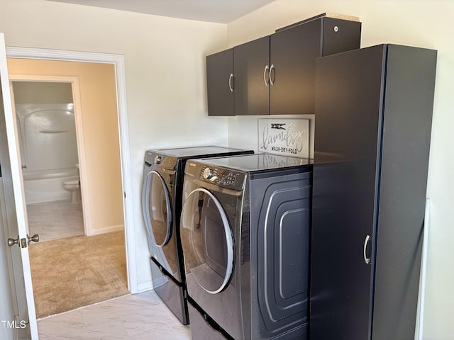 1121 Brookhill Way, Cary, NC 27519 - laundry area featuring cabinet space, independent washer and dryer, and light marble finish flooring