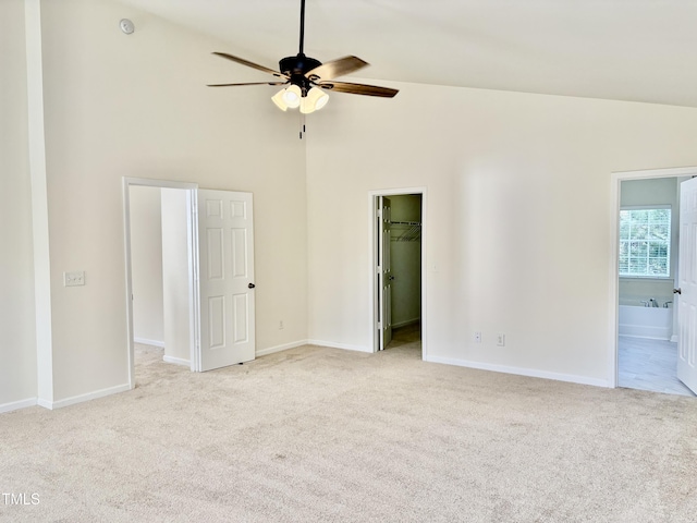 1121 Brookhill Way, Cary, NC 27519 - unfurnished bedroom featuring carpet flooring, high vaulted ceiling, a spacious closet, connected bathroom, and a closet