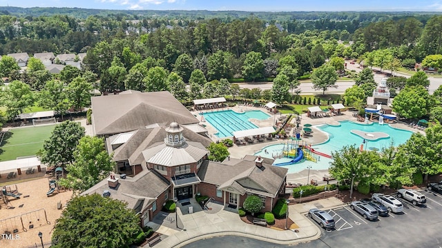 1121 Brookhill Way, Cary, NC 27519 - bird's eye view of a pool area and a forest