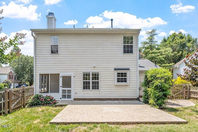 404 Ascott Way, Durham, NC 27713 - back of house with a patio, a chimney, a fenced backyard, and a gate