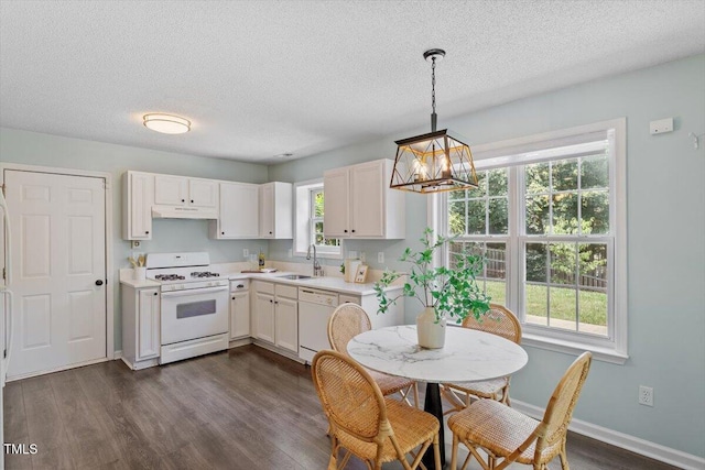 404 Ascott Way, Durham, NC 27713 - kitchen featuring white appliances, light countertops, a chandelier, under cabinet range hood, and dark wood-style flooring