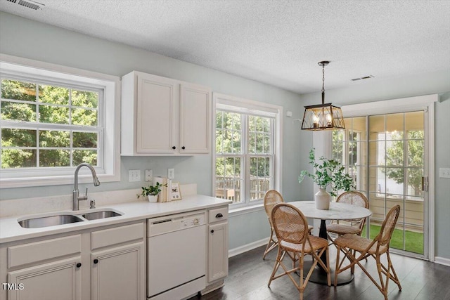 404 Ascott Way, Durham, NC 27713 - kitchen featuring white dishwasher, a textured ceiling, wood finished floors, a chandelier, and light countertops