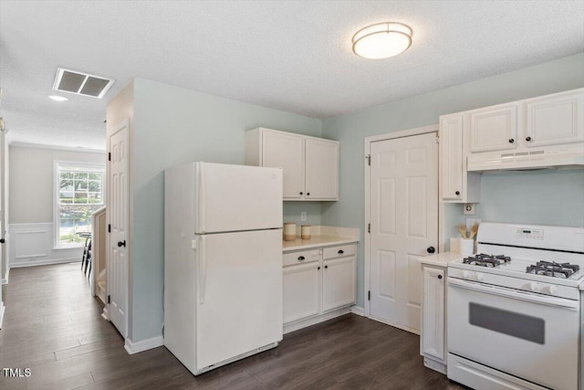 404 Ascott Way, Durham, NC 27713 - kitchen with white appliances, under cabinet range hood, dark wood finished floors, white cabinets, and a textured ceiling