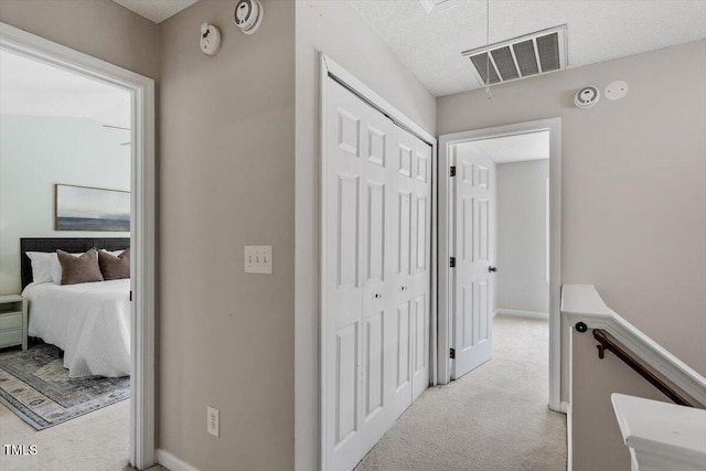 404 Ascott Way, Durham, NC 27713 - hallway featuring carpet and a textured ceiling
