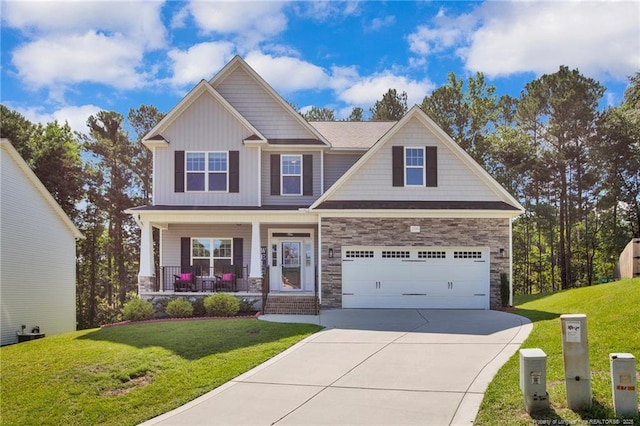 208 Walker Downs Cir, Fayetteville, NC 28305 - craftsman-style home featuring driveway, covered porch, a front lawn, and stone siding