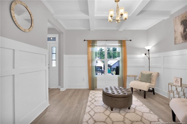 208 Walker Downs Cir, Fayetteville, NC 28305 - sitting room featuring a decorative wall, coffered ceiling, beam ceiling, light wood finished floors, and a chandelier