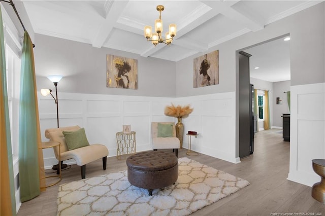 208 Walker Downs Cir, Fayetteville, NC 28305 - sitting room featuring coffered ceiling, a decorative wall, beamed ceiling, wood finished floors, and a chandelier