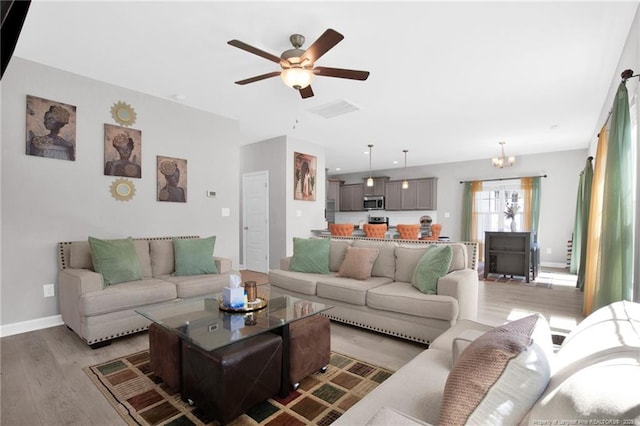 208 Walker Downs Cir, Fayetteville, NC 28305 - living room featuring a ceiling fan and light wood finished floors