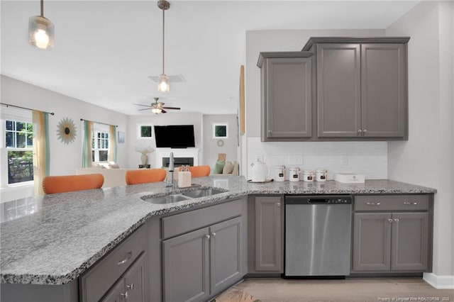 208 Walker Downs Cir, Fayetteville, NC 28305 - kitchen featuring stainless steel dishwasher, gray cabinetry, a fireplace, and a ceiling fan
