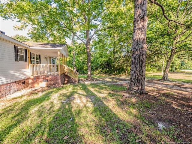 40 Ella Bell Rd, Clarkton, NC 28433 - view of green lawn featuring a porch