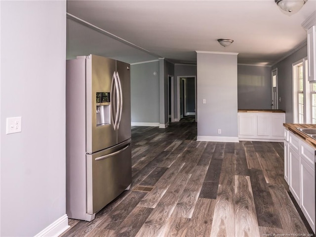 40 Ella Bell Rd, Clarkton, NC 28433 - kitchen featuring stainless steel refrigerator with ice dispenser, white cabinetry, dark wood-type flooring, ornamental molding, and dark countertops