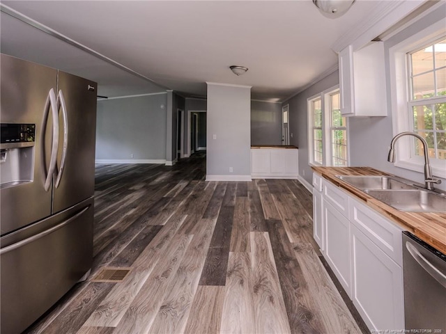 40 Ella Bell Rd, Clarkton, NC 28433 - kitchen featuring stainless steel appliances, white cabinets, dark wood-style floors, and wood counters