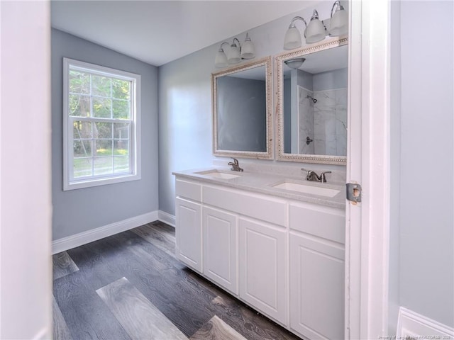40 Ella Bell Rd, Clarkton, NC 28433 - full bathroom with tiled shower, double vanity, and wood finished floors