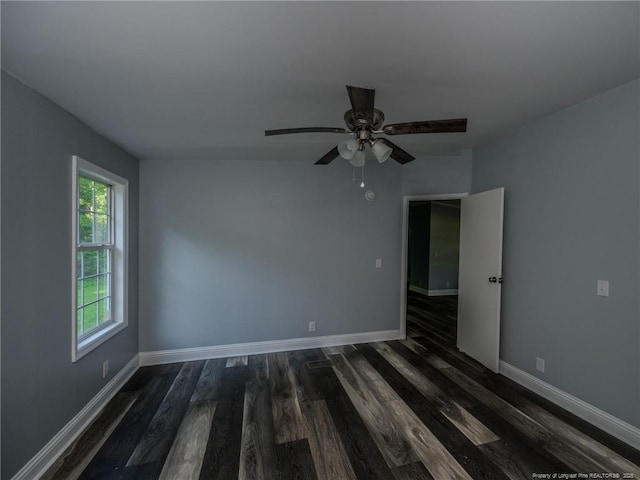40 Ella Bell Rd, Clarkton, NC 28433 - spare room with dark wood-style flooring and ceiling fan
