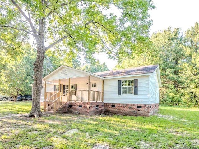40 Ella Bell Rd, Clarkton, NC 28433 - view of front of property with crawl space, a front yard, a porch, and stairway