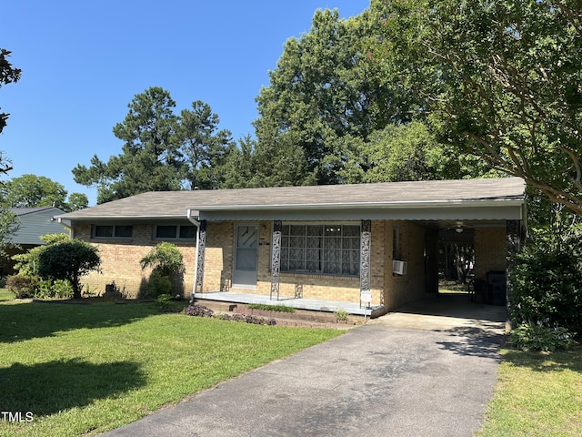 417 Sunnyview Rd, Henderson, NC 27536 - ranch-style home featuring brick siding, driveway, a front lawn, and an attached carport