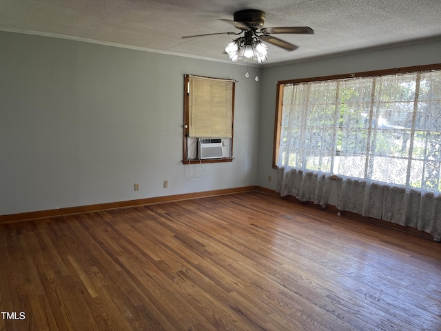 417 Sunnyview Rd, Henderson, NC 27536 - unfurnished room with a ceiling fan, wood finished floors, a textured ceiling, ornamental molding, and cooling unit