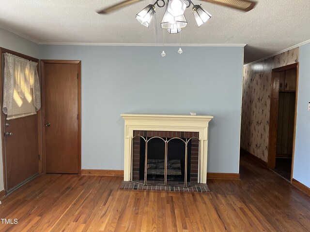 417 Sunnyview Rd, Henderson, NC 27536 - unfurnished living room with a ceiling fan, wood finished floors, a brick fireplace, crown molding, and a textured ceiling