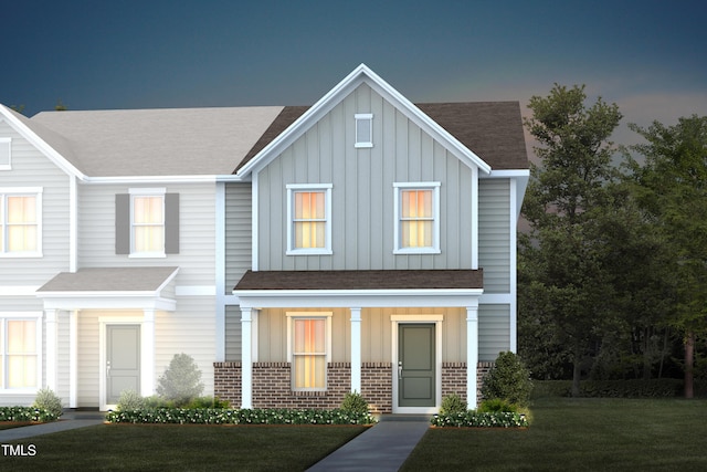 288 Fosterton Cottage Way, Raleigh, NC 27603 - view of property with board and batten siding, roof with shingles, brick siding, and covered porch