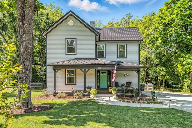 605 W Holt St, Mebane, NC 27302 - view of front facade with a porch, a metal roof, a front lawn, and a chimney