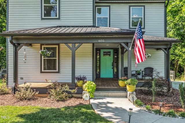 605 W Holt St, Mebane, NC 27302 - view of front of home with covered porch and a metal roof
