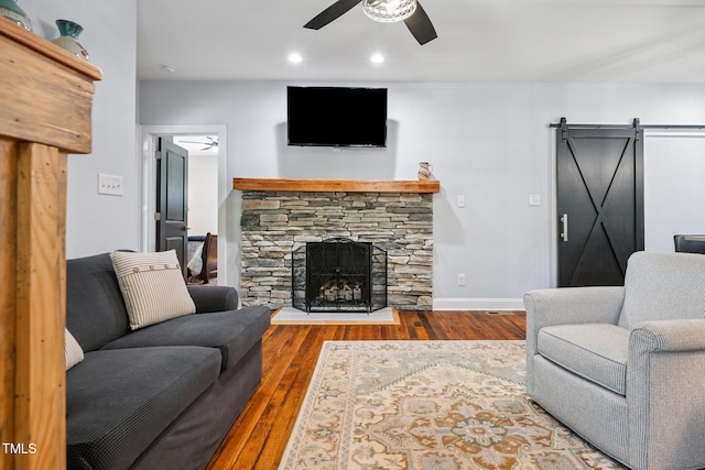 605 W Holt St, Mebane, NC 27302 - living area with ceiling fan, a barn door, hardwood / wood-style floors, a fireplace, and recessed lighting