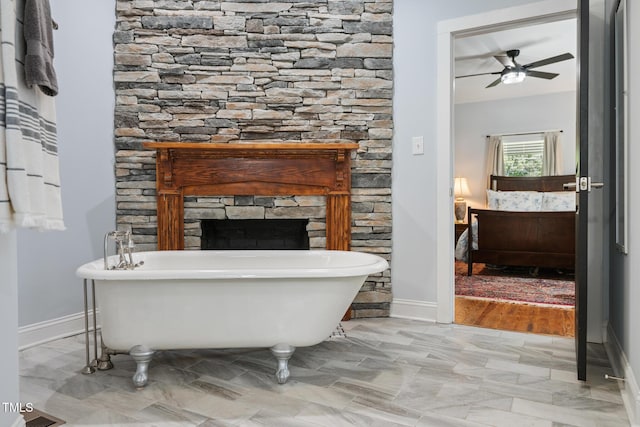 605 W Holt St, Mebane, NC 27302 - full bath featuring a freestanding bath, a fireplace, and ceiling fan