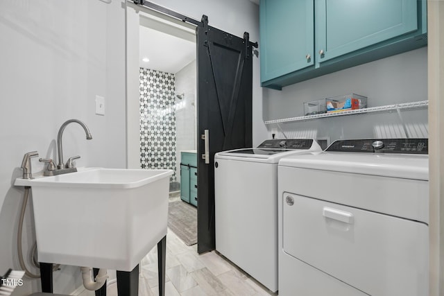 605 W Holt St, Mebane, NC 27302 - washroom with cabinet space, washing machine and dryer, and a barn door