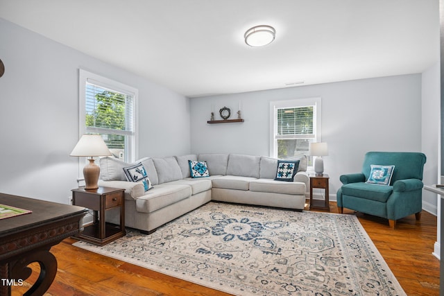 605 W Holt St, Mebane, NC 27302 - living room featuring healthy amount of natural light and wood finished floors