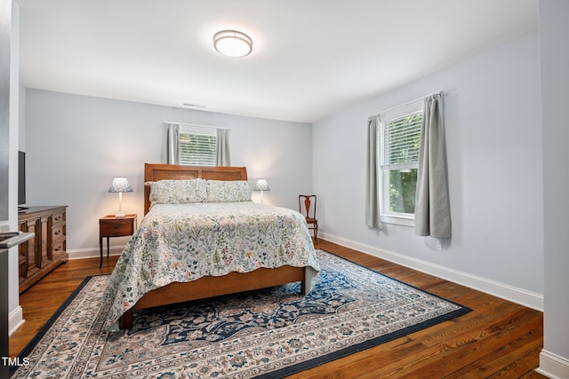 605 W Holt St, Mebane, NC 27302 - bedroom with dark wood-type flooring