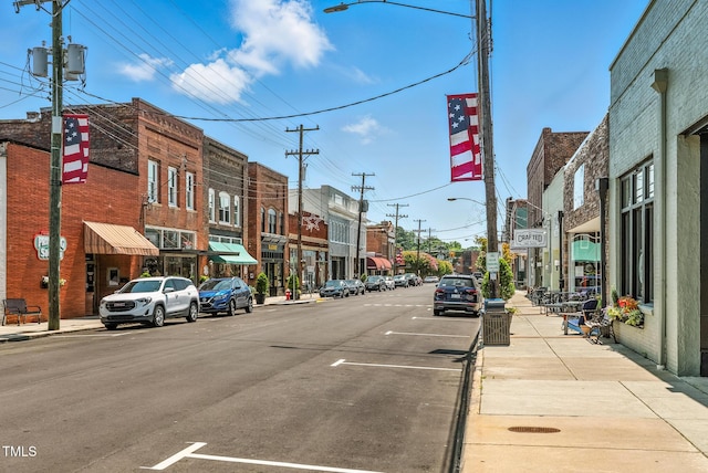 605 W Holt St, Mebane, NC 27302 - view of asphalt street featuring street lights, sidewalks, and curbs