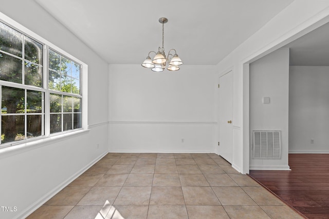7 Hannah Ct, Durham, NC 27713 - tiled spare room featuring a chandelier