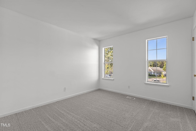 7 Hannah Ct, Durham, NC 27713 - carpeted empty room with baseboards