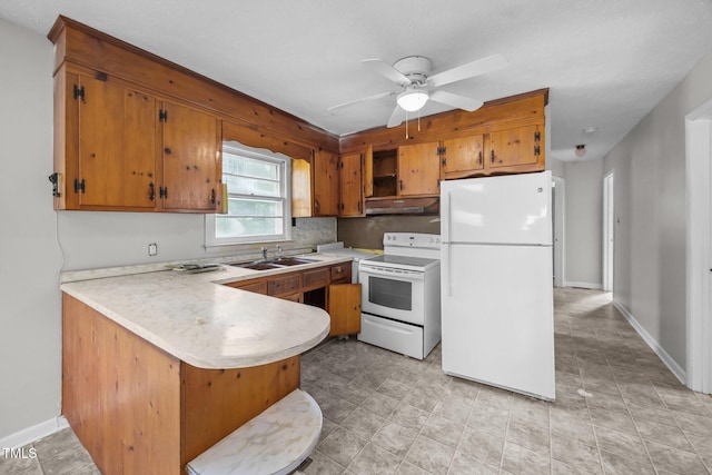 150 Alston Pruitt Rd, Louisburg, NC 27549 - kitchen with white appliances, under cabinet range hood, a peninsula, light countertops, and open shelves