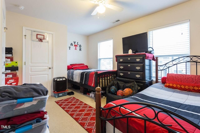 4009 Tresco Xing, Raleigh, NC 27616 - carpeted bedroom with multiple windows and ceiling fan