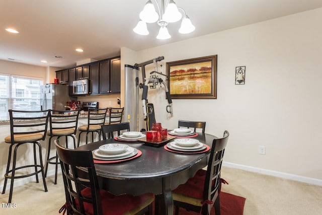 4009 Tresco Xing, Raleigh, NC 27616 - dining area featuring a chandelier, light colored carpet, and recessed lighting