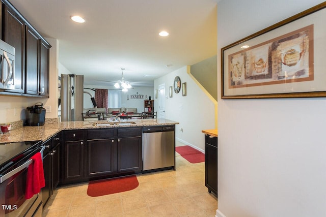 4009 Tresco Xing, Raleigh, NC 27616 - kitchen featuring stainless steel dishwasher, a peninsula, range with electric stovetop, light stone counters, and recessed lighting