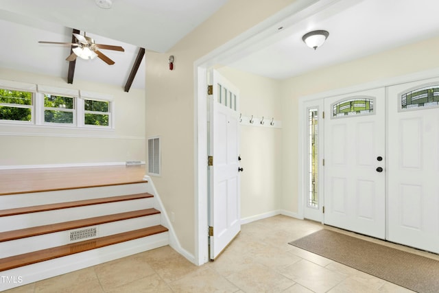 6608 Quiet Cove Ct, Raleigh, NC 27612 - tiled entrance foyer featuring ceiling fan, stairs, and beam ceiling