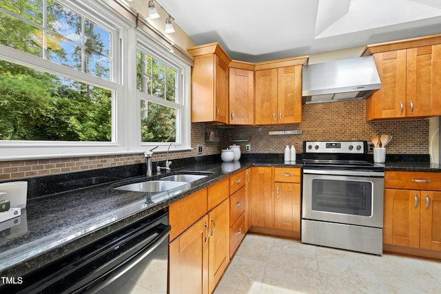 6608 Quiet Cove Ct, Raleigh, NC 27612 - kitchen with stainless steel range with electric cooktop, wall chimney exhaust hood, dishwasher, tasteful backsplash, and dark stone countertops