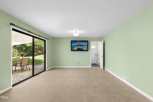 6608 Quiet Cove Ct, Raleigh, NC 27612 - unfurnished living room featuring baseboards and carpet floors