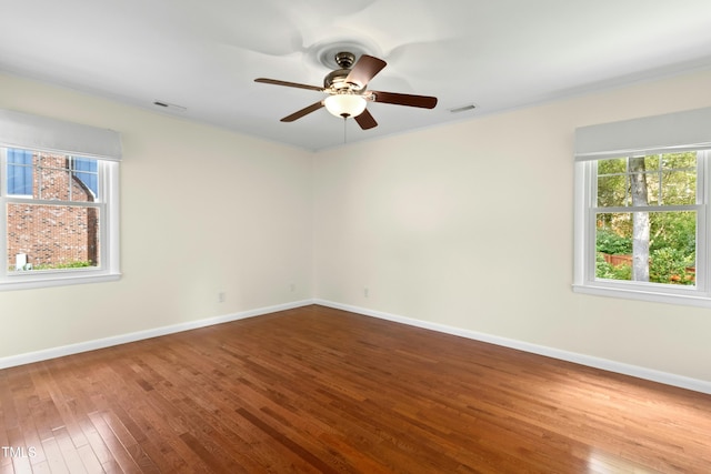 6608 Quiet Cove Ct, Raleigh, NC 27612 - unfurnished room featuring plenty of natural light, wood-type flooring, and ceiling fan