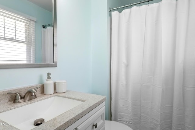 6608 Quiet Cove Ct, Raleigh, NC 27612 - bathroom featuring vanity and curtained shower
