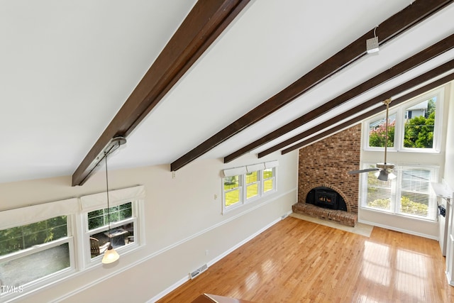 6608 Quiet Cove Ct, Raleigh, NC 27612 - unfurnished living room with light wood-type flooring, a brick fireplace, and a ceiling fan