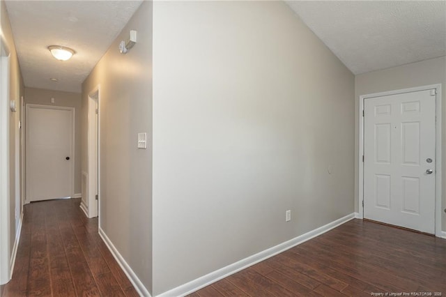5411 Archer Rd, Hope Mills, NC 28348 - hallway with dark wood-style flooring and a textured ceiling