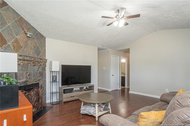 5411 Archer Rd, Hope Mills, NC 28348 - living area with lofted ceiling, a textured ceiling, a ceiling fan, hardwood / wood-style floors, and a tile fireplace